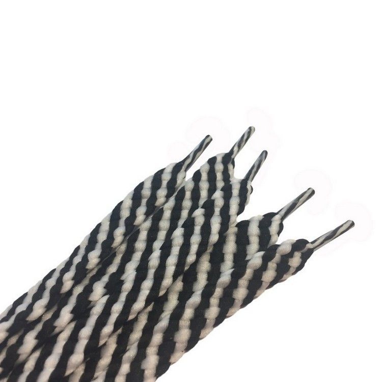Шнурки полегшені з запаяними кінцями кол біло-чорний 120см (уп 50пар) 318005 фото